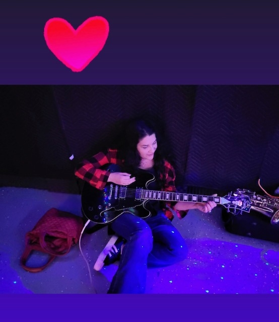 Jennifer Laskin Playing Guitar